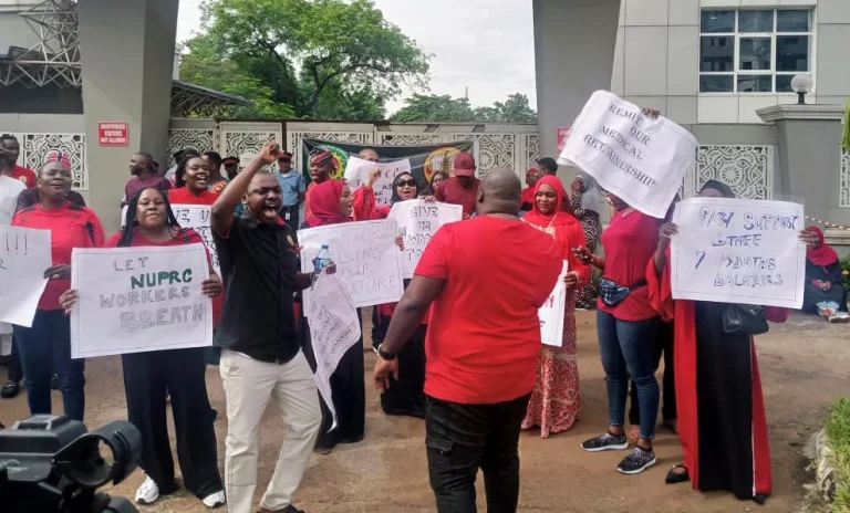 Some of the protesting workers outside Utako Office of the Upstream Petroleum Regulatory Commission, Abuja.