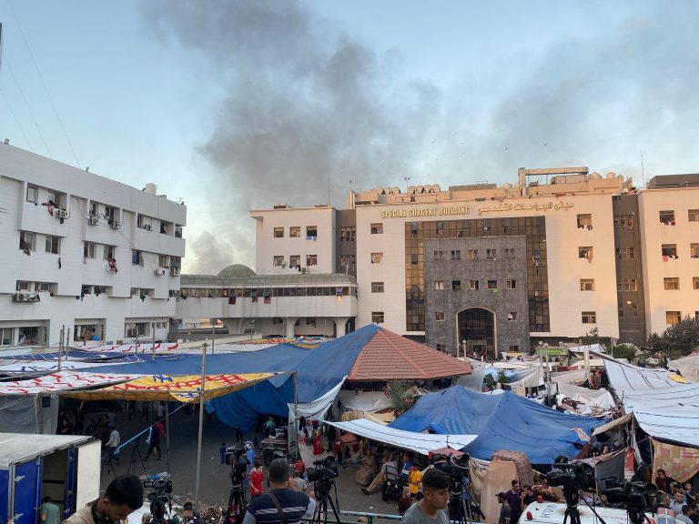 Smoke rises as displaced Palestinians take shelter at Al Shifa hospital, amid the ongoing conflict between Hamas and Israel, in Gaza City, November 8, 2023. REUTERS/Doaa Rouqa/File Photo