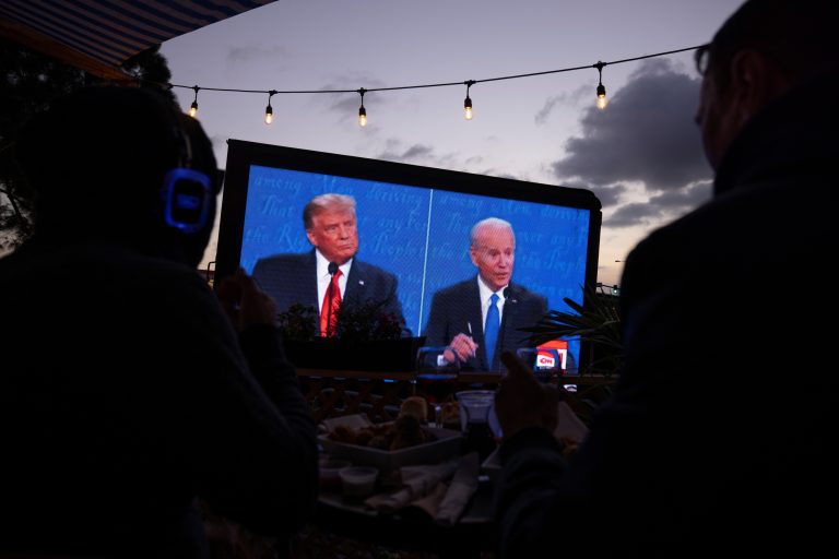 U.S. President Donald Trump and Democratic presidential candidate Joe Biden's presidential debate is broadcast and watched at a tavern in San Diego, California, U.S., October 22, 2020. REUTERS/Mike Blake