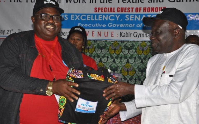 Comrade Adaji, President of Textile Union, left, and Comrade Aremu, right.