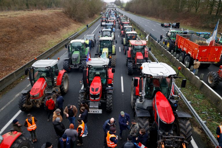 French farmers use their tractors to block the A1 highway near a highway toll station as they protest over price pressures, taxes and green regulation, grievances shared by farmers across Europe, in Chamant, near Paris, France, January 26, 2024. REUTERS/Yves Herman