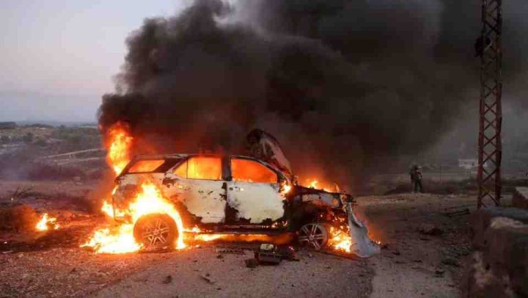 A car belonging to an Al Jazeera team burns at the site where Reuters visuals journalist Issam Abdallah was killed and six others were wounded by two tank rounds fired from Israel, in Alma al-Chaab, near the border with Israel, southern Lebanon, October 13, 2023. REUTERS/Thaier Al-Sudani/File Photo
