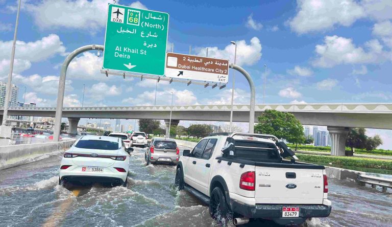 Cars drive through a flooded road after a rainstorm in Dubai, United Arab Emirates, April 17, 2024. REUTERS-Rula Rouhana