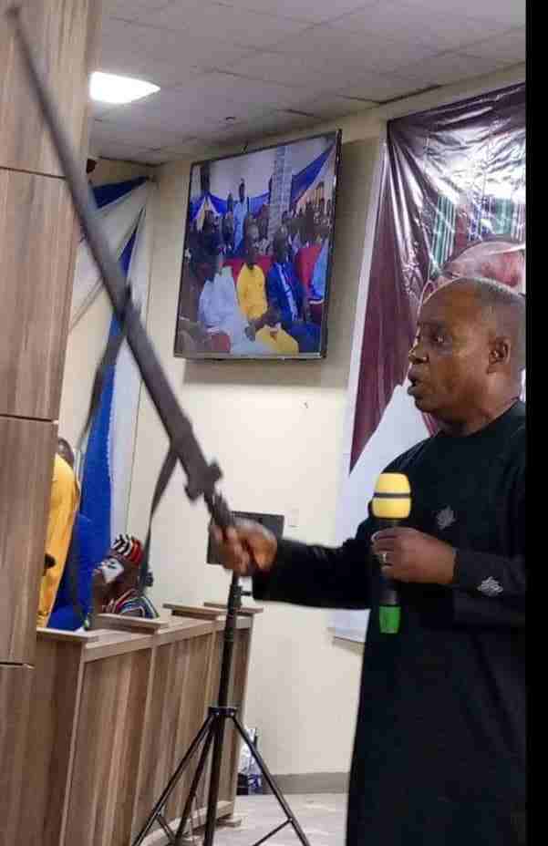 Dr Agbinda presenting a sword to Ortom as a symbol of his advocacy.