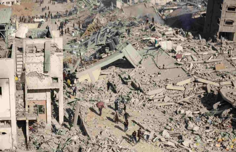 Israeli Troops Exit Gaza’s Shifa Hospital, Leaving Rubble And Bodies Palestinians inspect destroyed houses and buildings at the area around Al Shifa Hospital