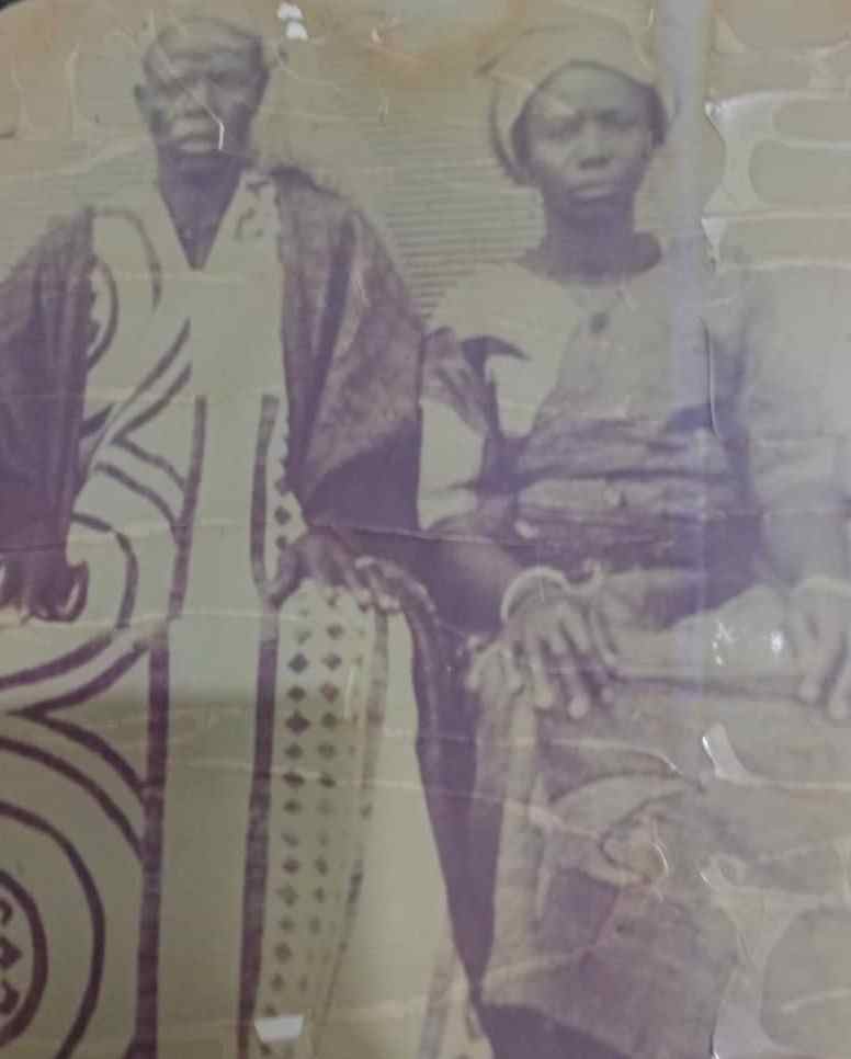 A faded but still discernible photograph of Mama and her young hubby, both now deceased.