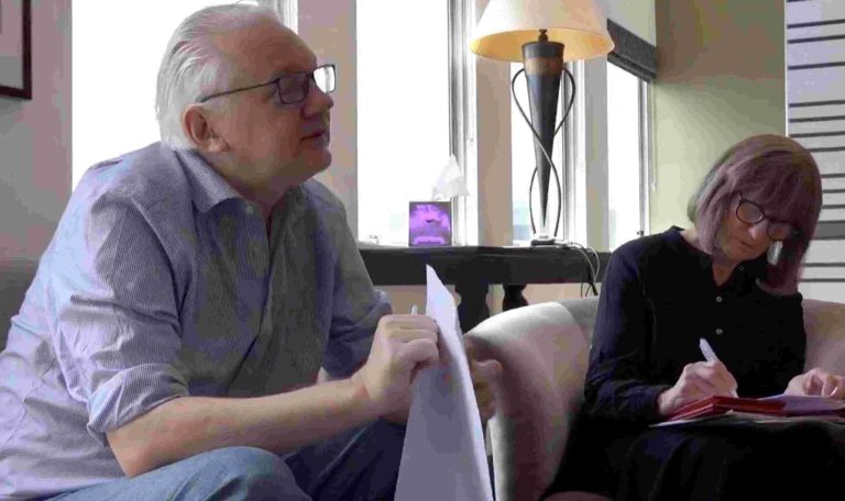 WikiLeaks founder Julian Assange holds a document at a location given as London, Britain, in this still image from video released June 25, 2024. "@wikileaks" via X/Handout via REUTERS