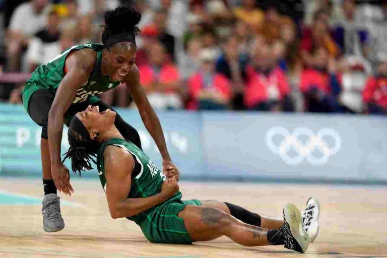 Nigeria’s Promise Amukamara, left, and Ezinne Kalu celebrate during the women’s basketball game against Canada on August 4. Mark J. Terrill-AP