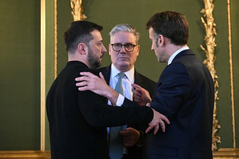 Ukraine's President Volodymyr Zelenskiy, Britain's Prime Minister Keir Starmer and France's President Emmanuel Macron embrace...