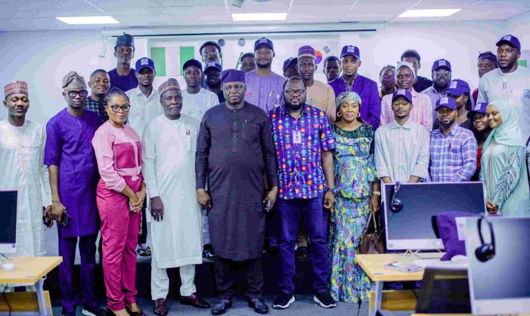 The Minister of Humanitarian Affairs and Poverty Reduction, Dr. Nantewa Yiwaltda, and the President-CEO, DBI, Mr. David Daser, with participants at the graduation ceremony of 35 youths trained by DBI under the Ministry's training programme