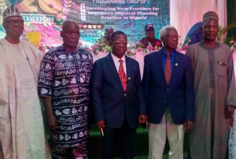 NITP president, Ogbonna (middle) in a group photograph with others during the opening ceremony of the MCPDP in Makurdi, Wednesday.