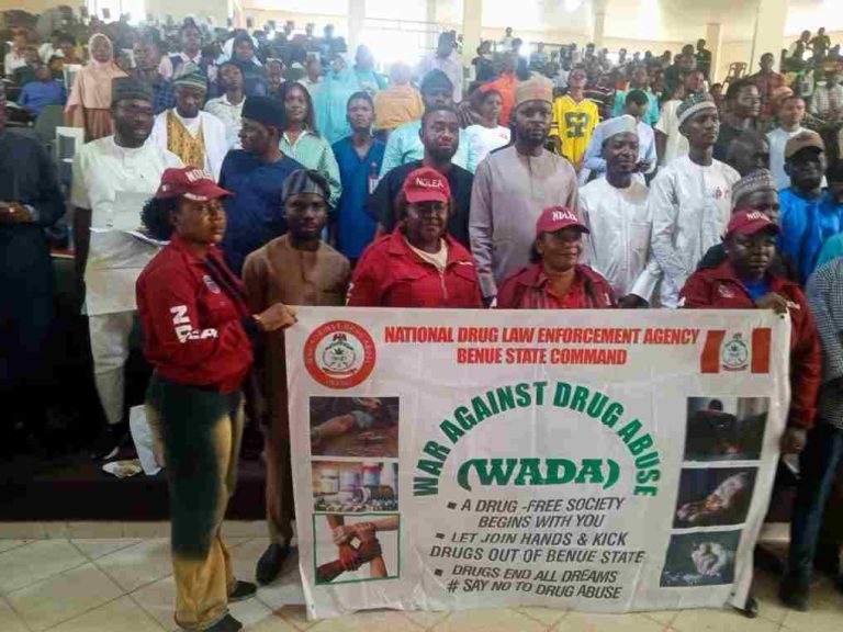 Group photograph of the NDLEA delegation with students during the public lecture on Friday