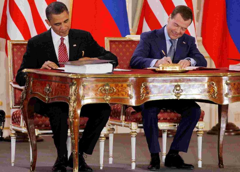 Barack Obama (L) and Dmitry Medvedev, who were then the U.S. and Russian presidents, sign the new Strategic Arms Reduction Treaty (START II)