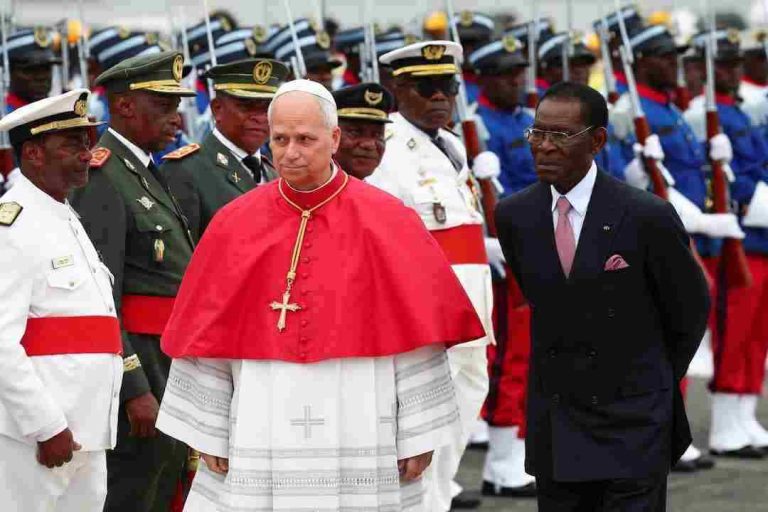 Pope Leo XIV walks next to President of Equatorial Guinea Teodoro Obiang Nguema Mbasogo upon his arrival at Malabo International Airport