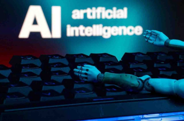 FILE PHOTO - Illustration shows message reading AI artificial intelligence, keyboard and robot hands - REUTERS