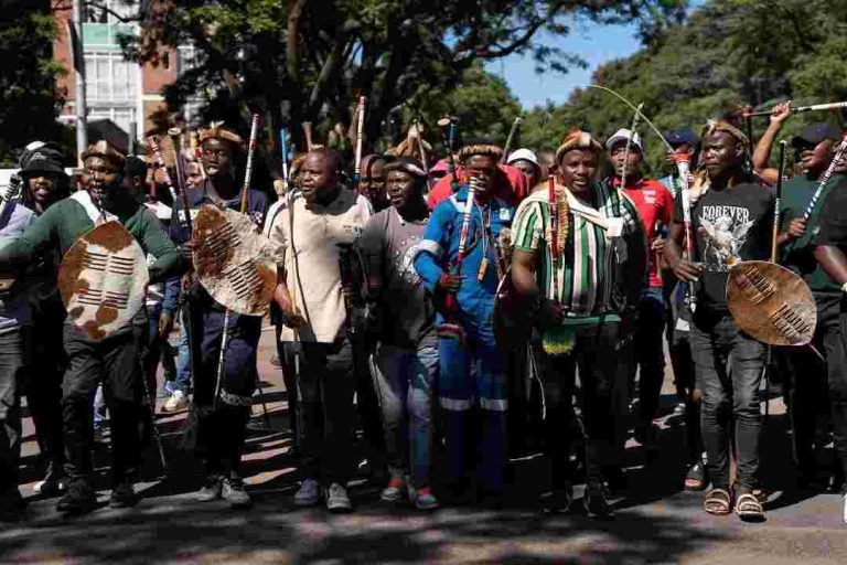 Members of civil society groups and human rights organisations take part in a march calling for stronger government action