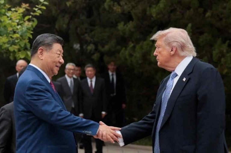 U.S. President Donald Trump shakes hands with Chinese President Xi Jinping.