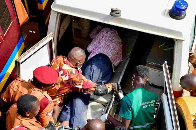 Detained Ugandan Opposition Figure Is Unconscious, In Intensive Care, Wife Says Detained Ugandan opposition figure Kizza Besigye is put in an ambulance