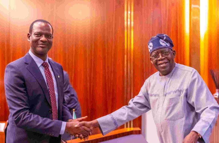 Finance Minister Taiwo Oyedele Says Subsidy Savings Swallowed By Debt Burden, Higher Public Spending File photo of the Finance Minister, Taiwo Oyedele, shaking hands with President Tinubu.