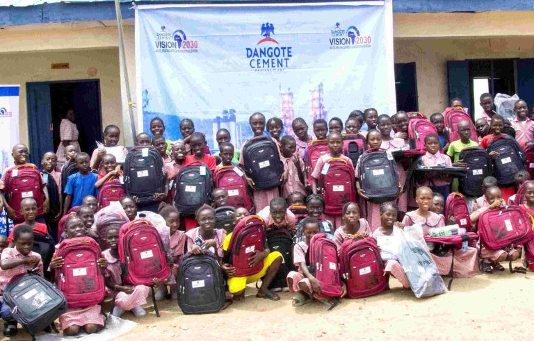 Pupils of UBE LGEA School, St. Luke Model II, Adankolo, Lokoja LGA during the distribution ceremony of educational materials by the Dangote Cement Plc at the weekend.